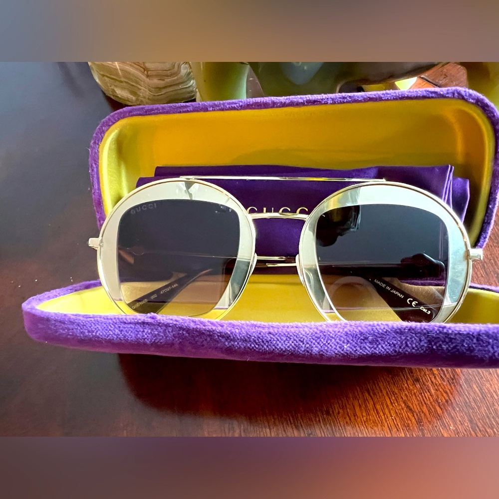 BEAUTIFUL GUCCI GG0105S Flashy gold frame gold in eyeglass bordered sunshades.